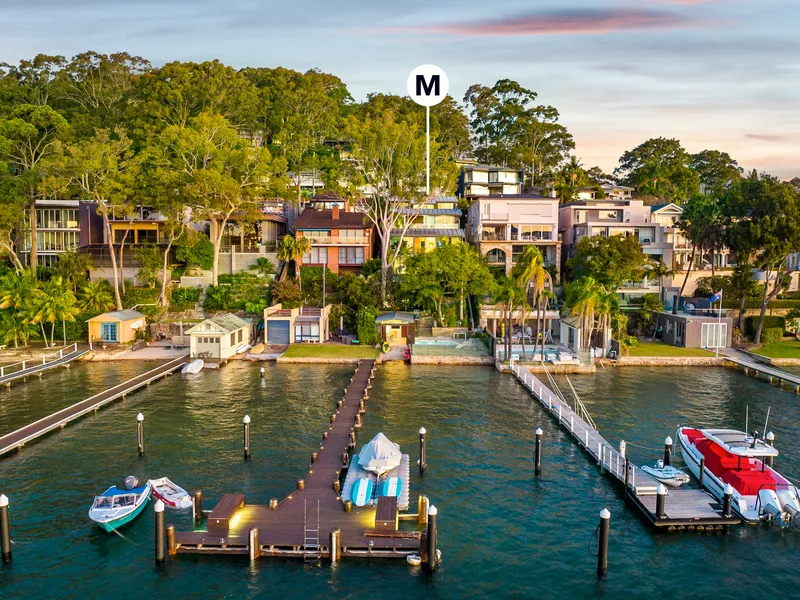 Rare north facing waterfront with breathtaking 180 degree views, pool and permanent mooring