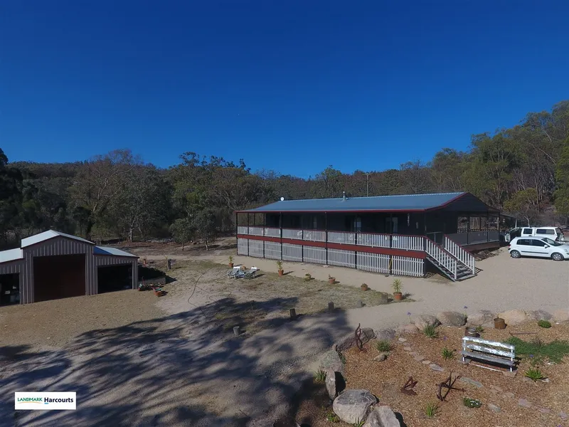 Two houses, huge shed, stables & room for a pony on acreage