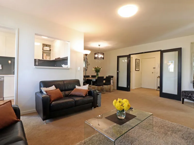 Elegant, spacious apartment with secure off-street parking. Full laundry,balcony