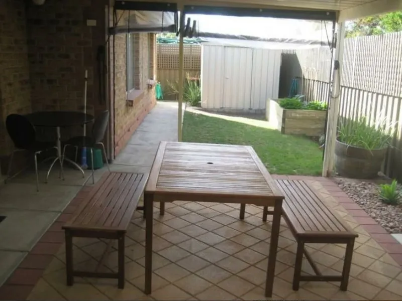 2 bedroom unit with courtyard, 2 tool sheds, garage and drive through parking. Only attached by garages, built in robes in both bedrooms. Park setting