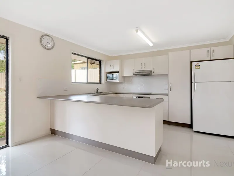 Great home within walking distance to John Paul College and many shops!