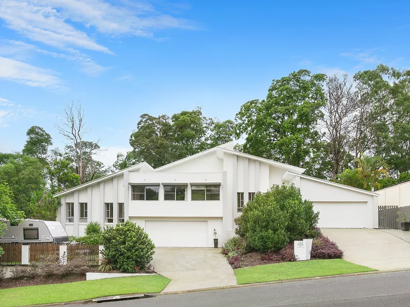 Modern, elevated home in peaceful manicured estate 