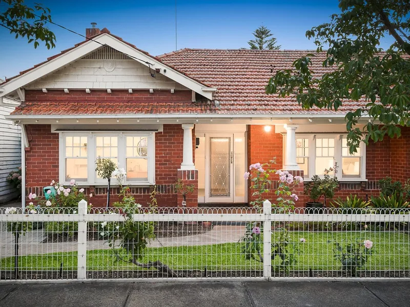 NORTH FACING SOLID BRICK HOME IN THE HEART OF HAWTHORN