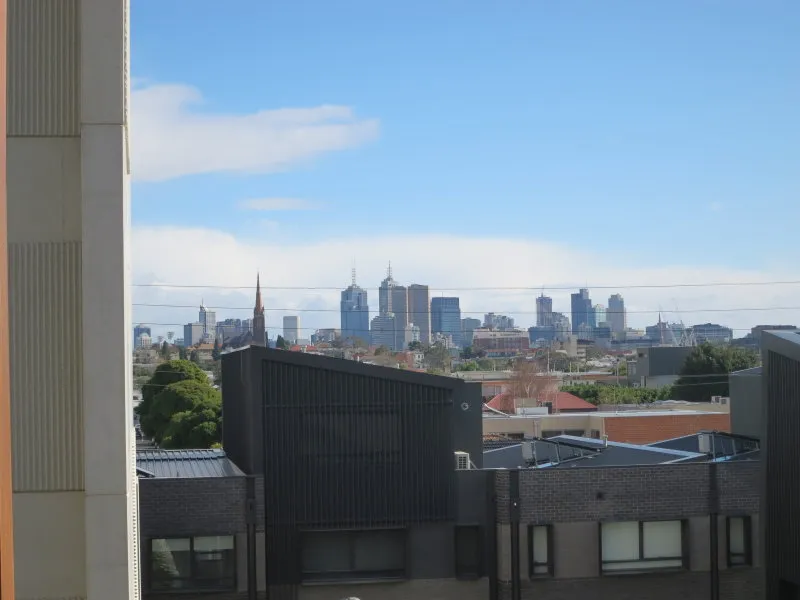 Keep the City in Your Sights from this Chic Ivory Apartment!