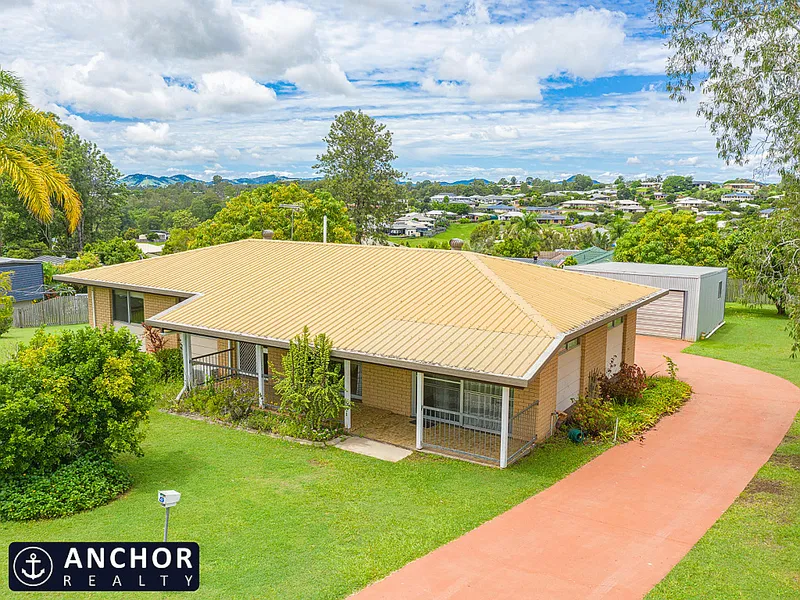 Brick home on flat 1/2 acre block with town services! 