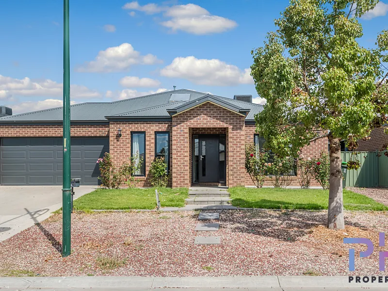 WELL SIZED FAMILY HOME WITH LANDSCAPED YARD 