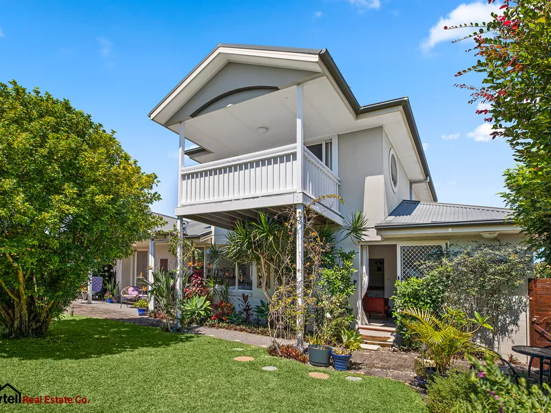Rare free standing townhouse close to shops and beach.