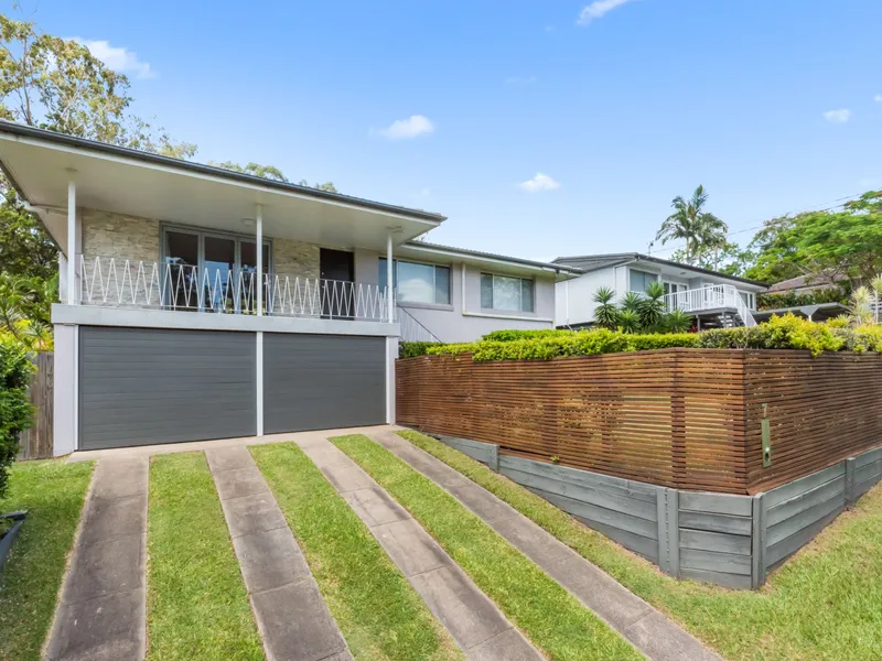 PEACEFUL, ELEVATED 3 BEDROOM HOME WITH OPEN PLAN LIVING AND 2 OFFICE OR STUDY ROOMS INCLUDING STORAGE SPACE