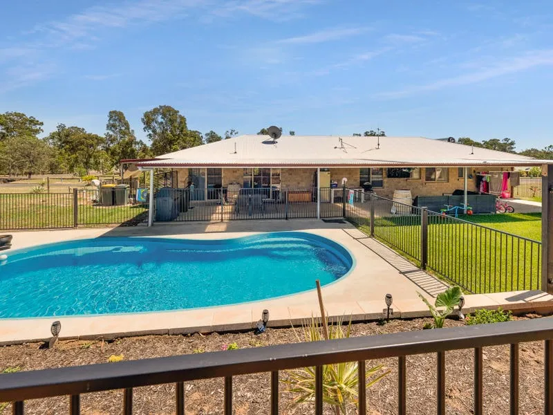 FOUR BEDROOM BRICK WITH SHEDS & POOL!