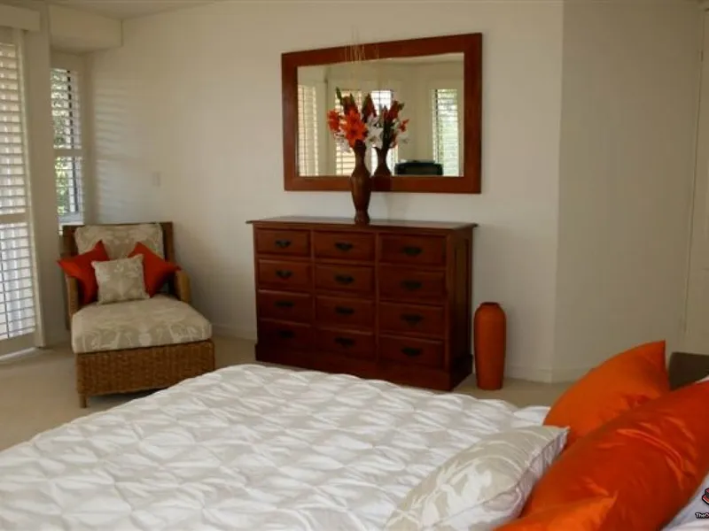 Private, secure residence situated lakeside in exclusive coastal estate.