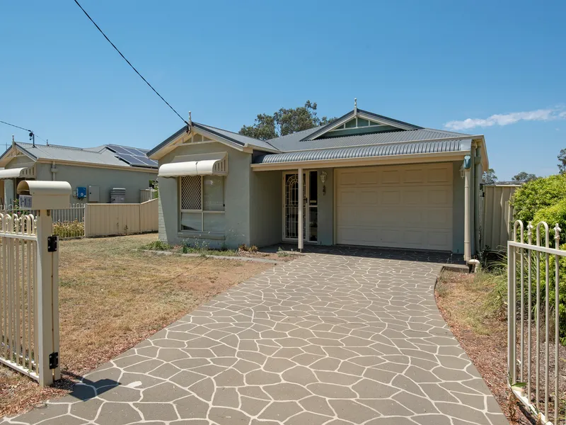 3 Bedroom 2 Bathroom Solid Brick Home on Large Block!