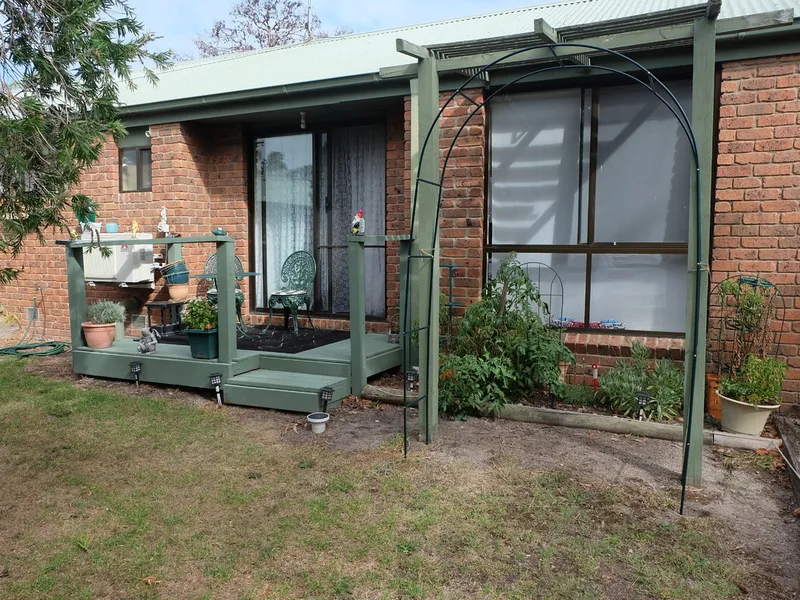 NESTLED IN A GARDEN SETTING