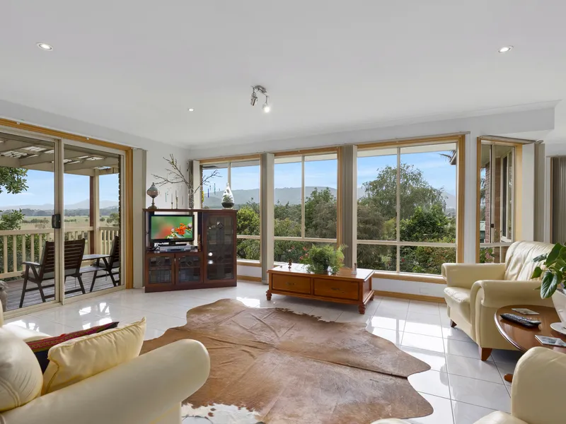 Stunning views to hills and farmland.