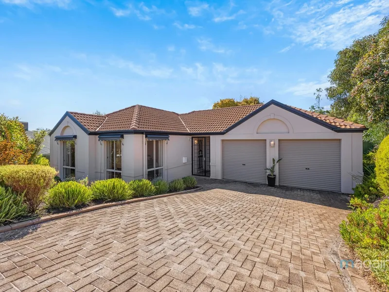 This elegant and versatile three-bedroom family residence epitomises sophistication, nestled in the tranquil and picturesque suburb of Aberfoyle Park
