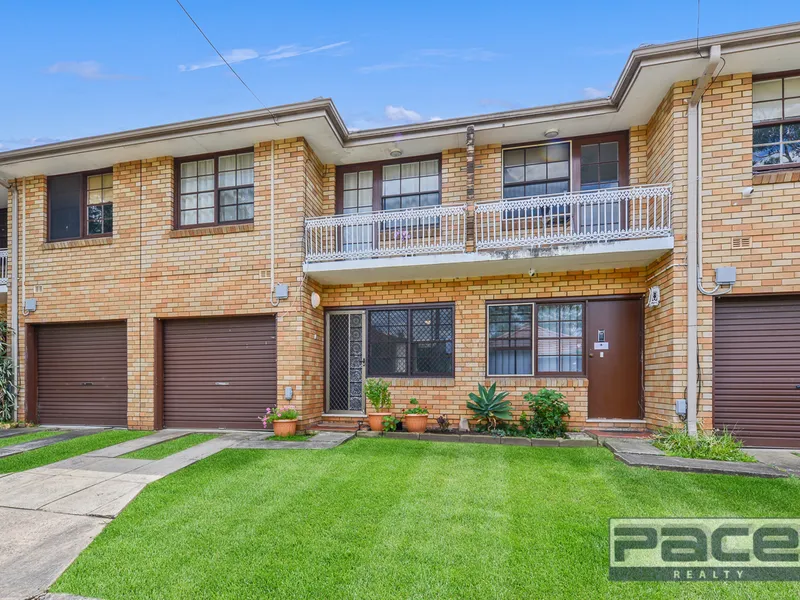 Sun filled townhouse offering space, security and convenience