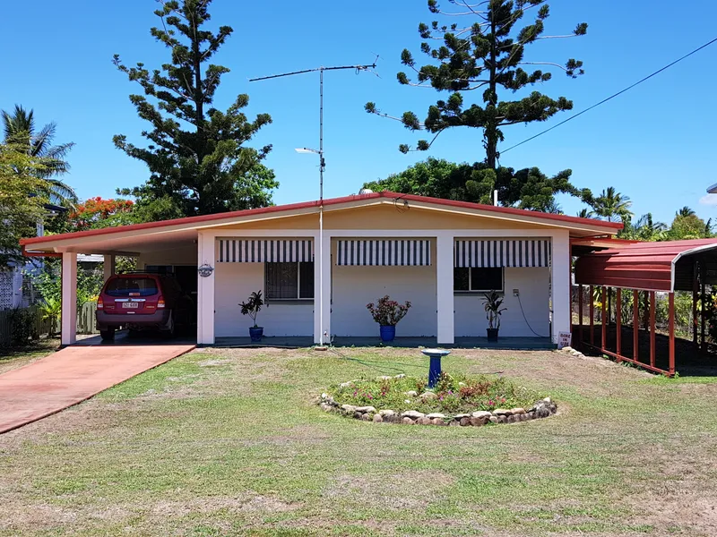 This spacious beachside three bedroom + office home is close to the beach with a double garage & carport