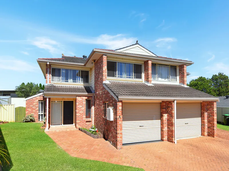 Two storey duplex on a hill with views of the valley