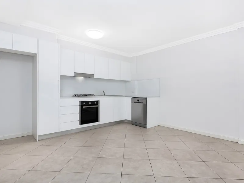 IMMACULATE SUN-FILLED APARTMENT THAT IS IDEALLY LOCATED TO THE REAR OF THE COMPLEX