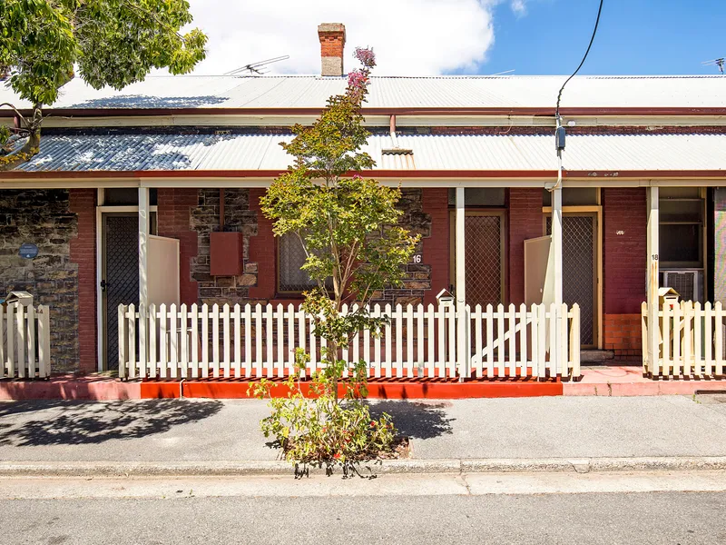 For a savvy investment with charm in spades (and a twist), turn to a row cottage within Gouger's reach...