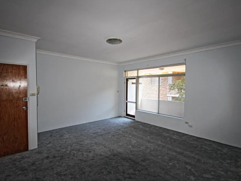 Well presented spacious two bedroom top floor unit