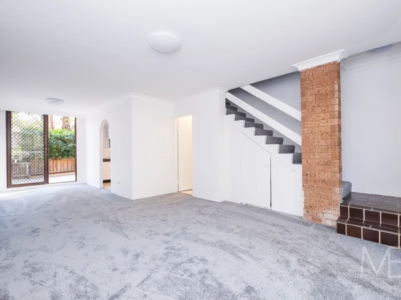 UPDATED TOWNHOUSE OFFERING SUPREME CONVENIENCE