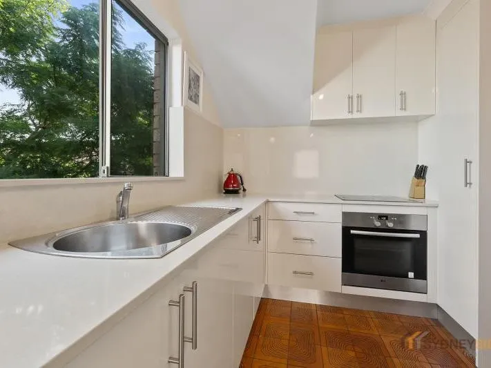 Immaculate Split-Level Apartment in Prime Location
