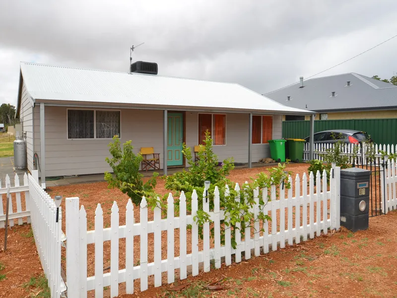 Behind the white picket fence!