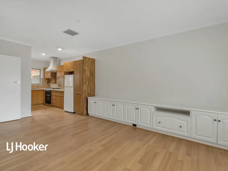 Beautiful 2 bedroom single story unit set back off the main road