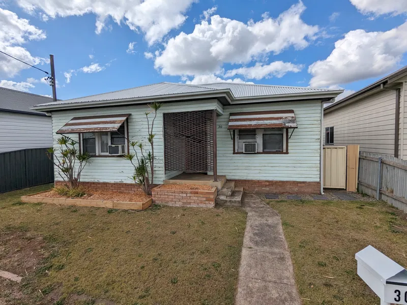 FRESHLY UPDATED HOME WITH LAWN MAINTENANCE INCLUDED