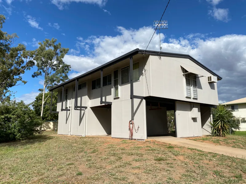 LOVELY HIGH-SET HOME WITH AN INTERNAL STAIRCASE ON A HUGE BLOCK OF LAND! AN INVESTORS DREAM! 