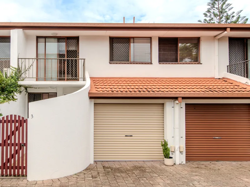 SPACIOUS TOWNHOUSE OFFERS SECLUDED COMFORT IN A COVETED LOCALE