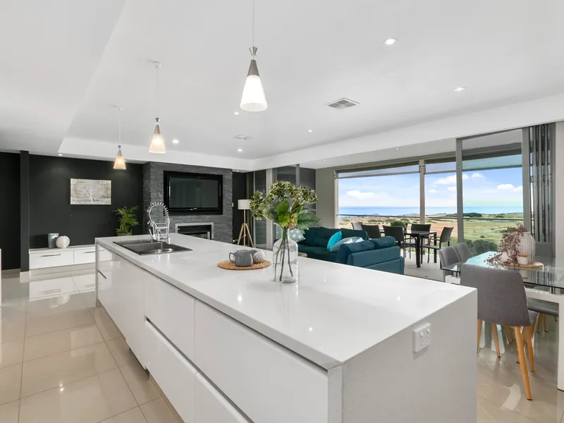 3 levels of luxury living with panoramic north facing views across Moana beach & conservation reserve
