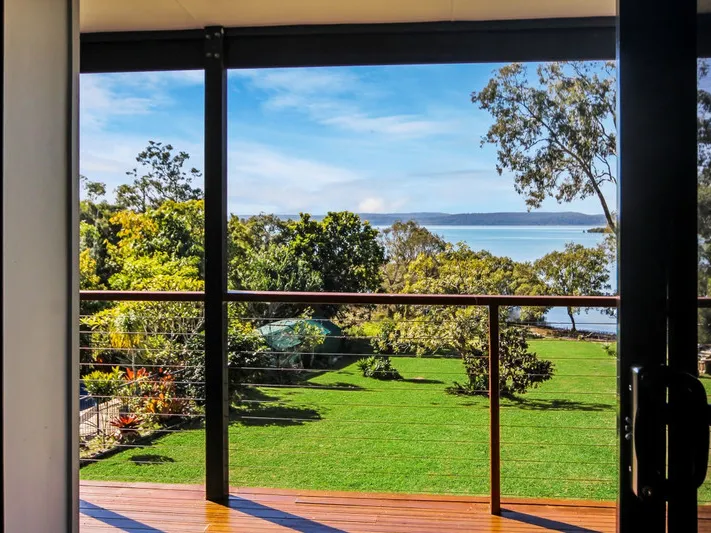 MAGICAL WATERFRONT PROPERTY BOASTING THREE HOMES!