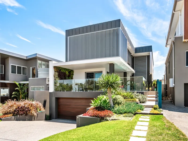 Stunning modern masterpiece just steps from the sand