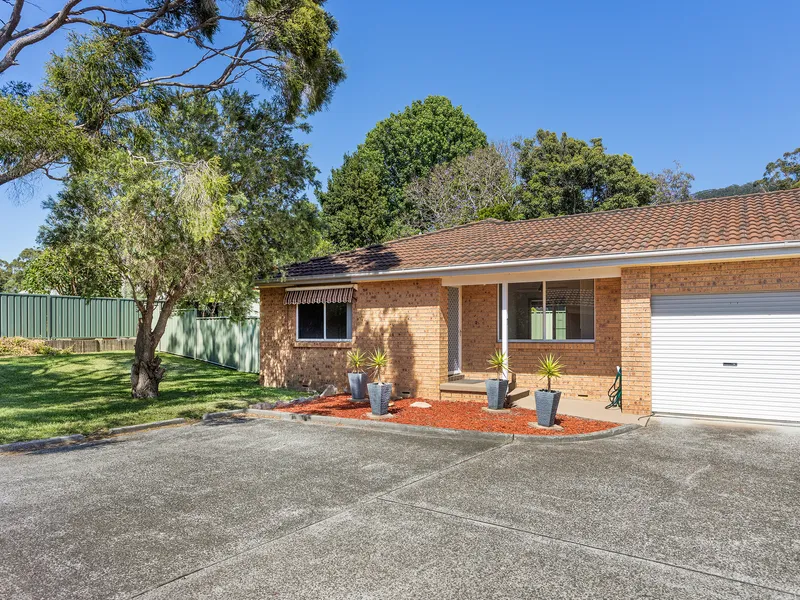 Quaint and private villa with grassed yard