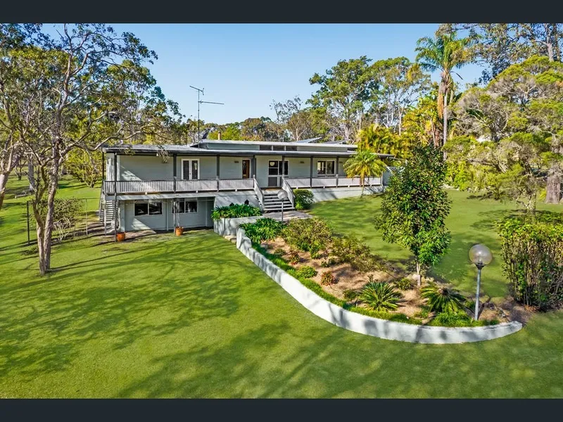 A Lifestyle Opportunity Not to be Missed Living on 4.75 Acres
