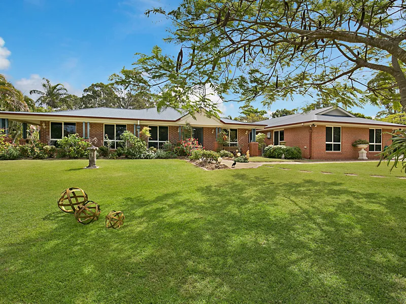 SEEING REALLY IS BELIEVING for this sprawling and immaculately landscaped acreage property!!