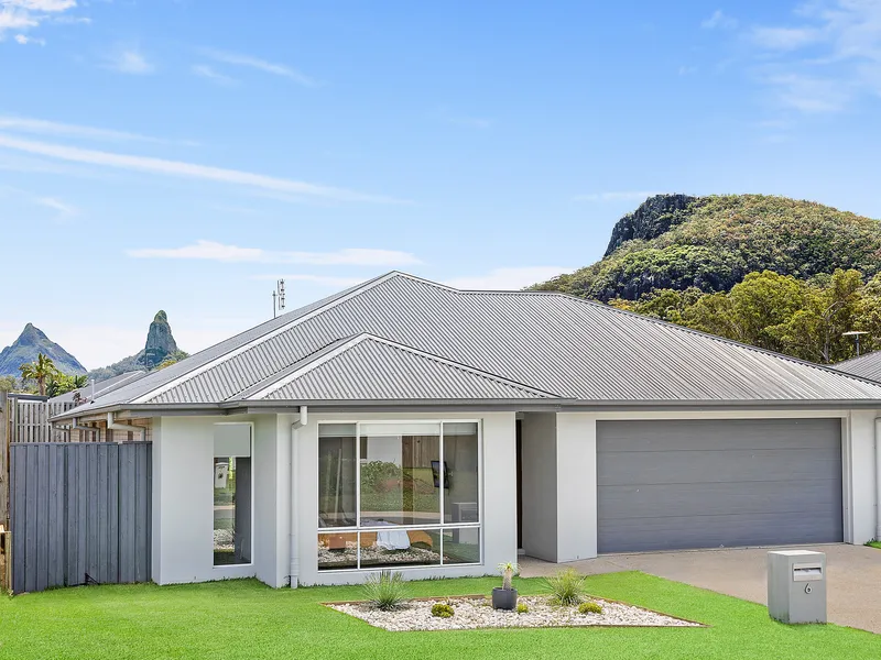 Incredible four-bedroom home in sought-after Glass House Mountains estate with sparkling pool and mountain vistas
