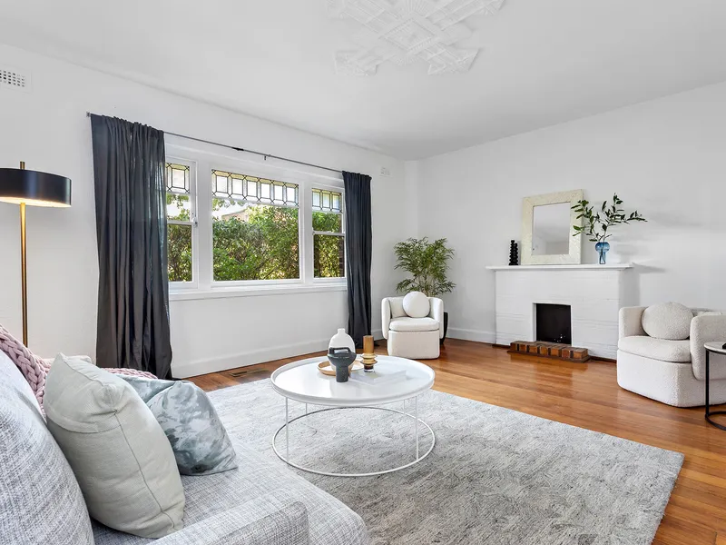 A delightfully leafy Deco with wraparound courtyard and lock-up garage