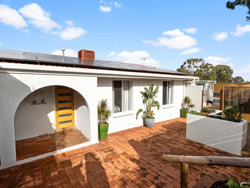 An Entertainer's Delight! Family Living on a Generous Corner Allotment!