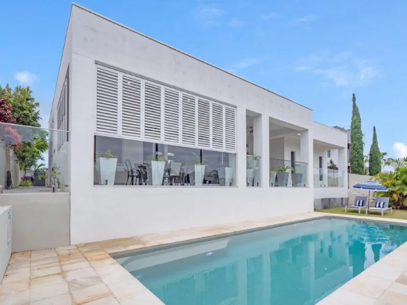 Rare single level waterfront designer home with dual living potential Emerald Lakes