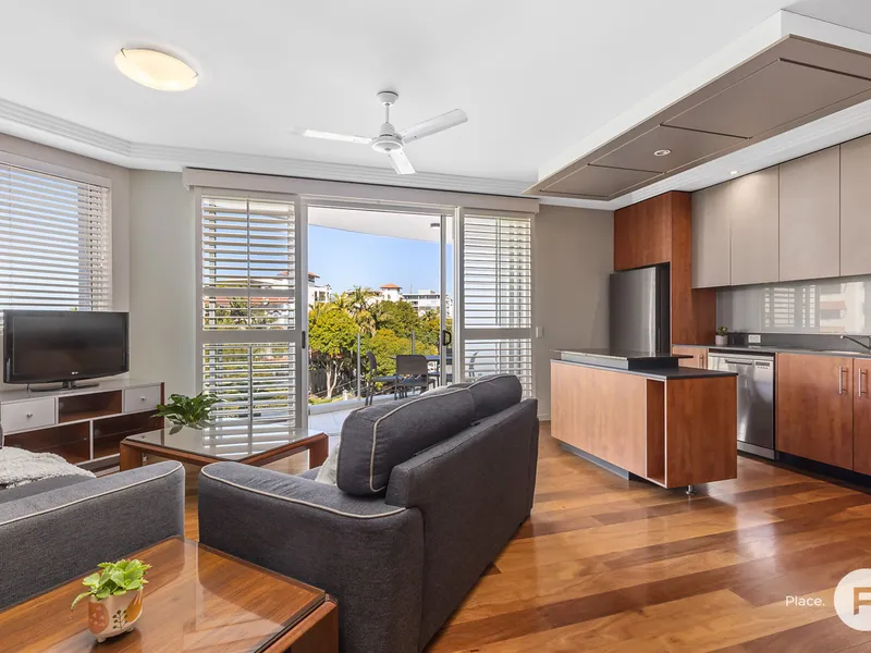 Highly sought top floor residence moments from Newstead Riverwalk