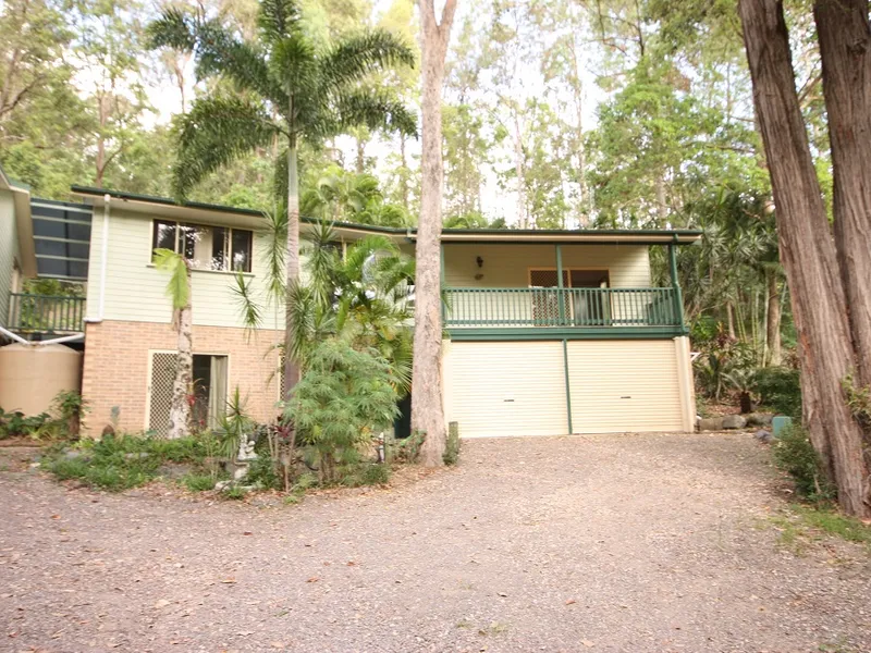 4 BEDROOM FAMILY HOME SET IN TROPICAL GARDENS ON RURAL BLOCK