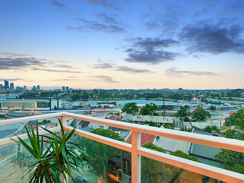 Top floor apartment with balcony and water views