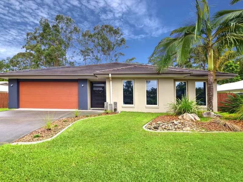 Stunning 4 bedroom family home with tranquil rainforest reserve backdrop.