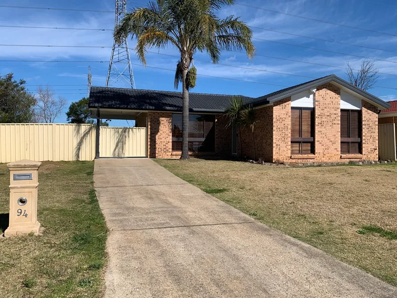 3 BEDROOM HOME WITH CARPORT BEHIND GATES AND VERY GOOD SIZE YARD