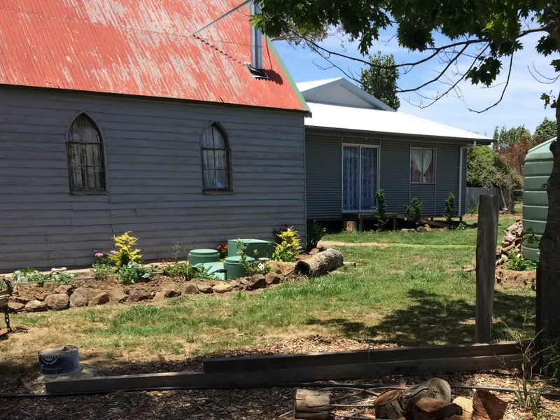 NEWLY BUILT HOME AND OLD CHURCH