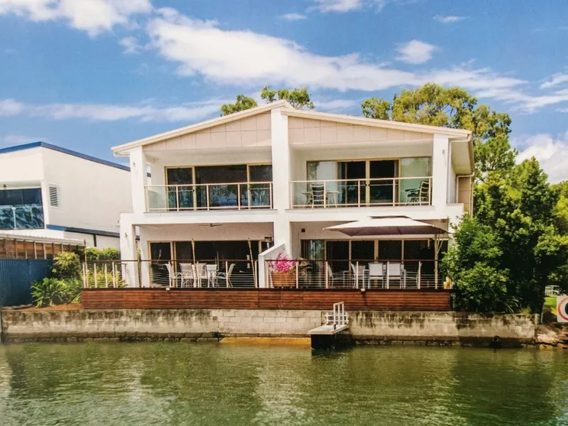 Waterfront modern entertainer with large deck.