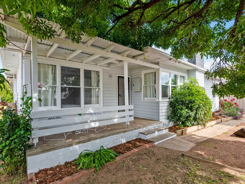 UPDATED HOME ON QUARTER ACRE