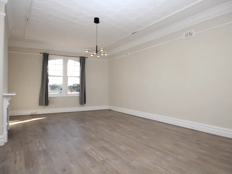RENOVATED TWO BEDROOM APARTMENT ABOVE A SHOP WITH PRIVATE ENTRY FROM REAR